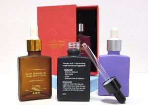 China Cosmetic Packaging Empty 30 Ml Square 1 Oz Glass Dropper Bottles With Paper Box on sale