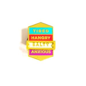 China Social Phenomenon Theme Custom Hard Enamel Slide Lapel Pin with Rubber Caps on sale