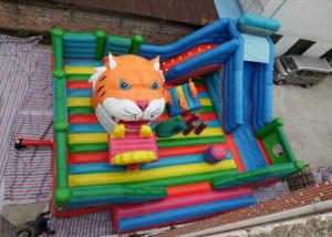China Amusement Tiger Head childrens Inflatable Bouncy Castle With Slide on sale