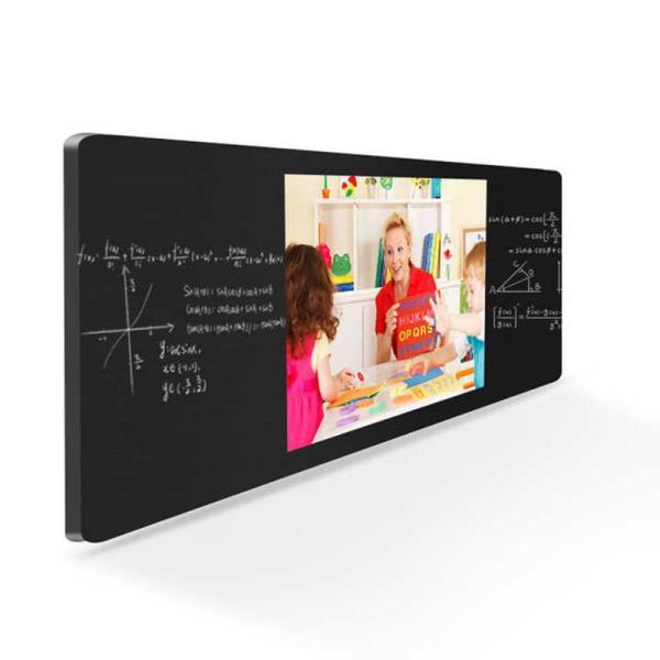 An angled smart board showing a teacher working with a young child on the main screen during a lesson