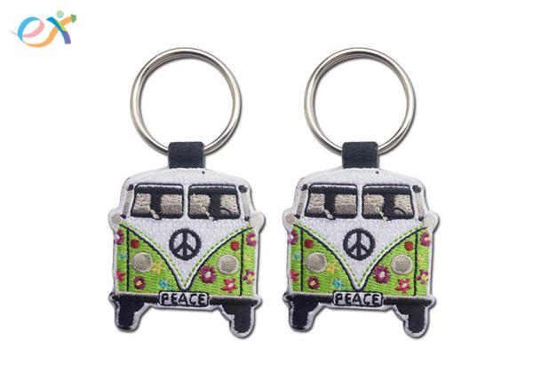 Cheap Twill Background Embroidered Keychain Irregular Shape With Laser Cut for sale
