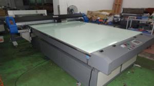 A Starjet UV Flatbed Printer with Glass Surface to Print Board Material