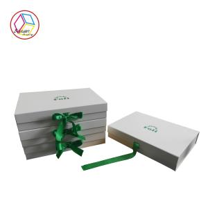 China Foldable White Box Green Logo Apparel Packaging Boxes With Ribbon on sale